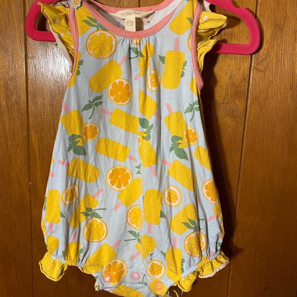 Lemon Bubble, buttons on the shoulders. Cute.